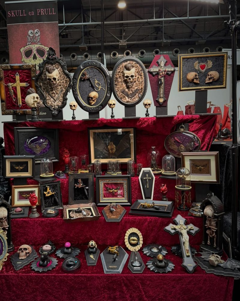 Red velvet tiers of framed moths, bats and tattoo machines under the Skull en Prull banner