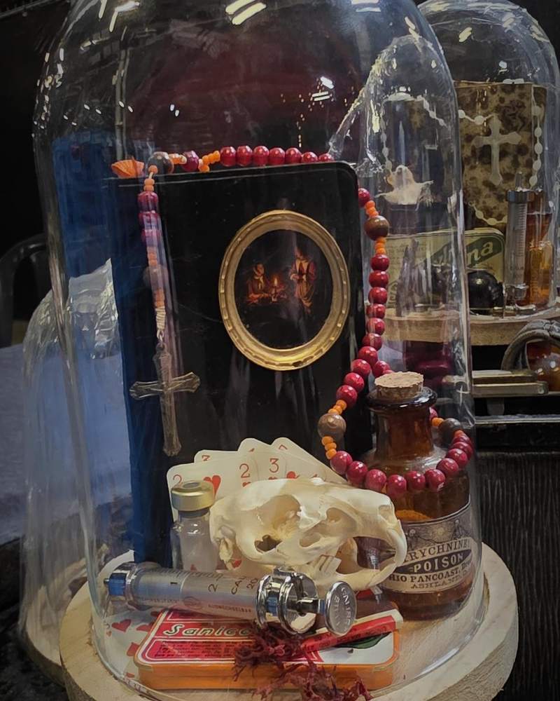 Still life with bible, glass dome and skull